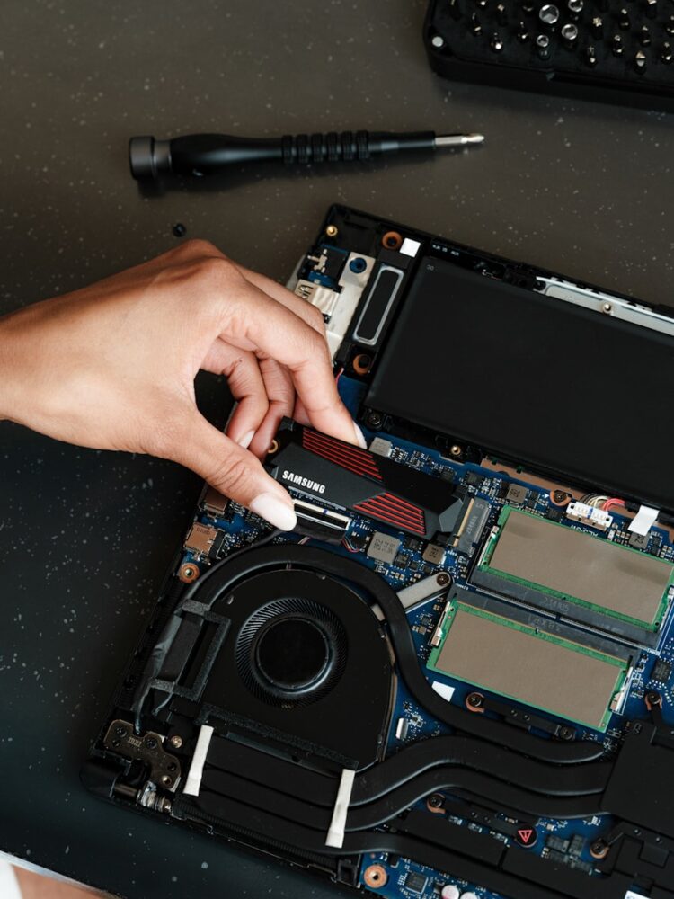 A person is working on a laptop computer